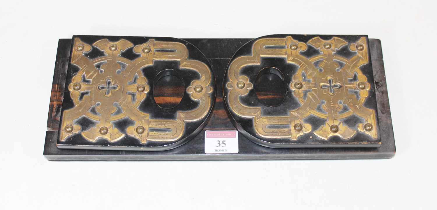 A Victorian brass mounted calamander bookslide, w.33cmCondition report: Brass mounts are quite