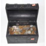 A leather clad dome topped jewellery casket, containing various English and world coins, to