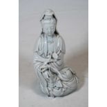 A blanc-de-chine figure of Guanyin, in kneeling pose, having impressed seal mark, h.16cmCondition