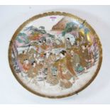 A Japanese Meiji (1868-1912) period charger, typically decorated with figures within a mountain