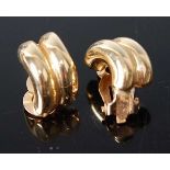 A pair of modern yellow metal ear clips, each stamped 14k and test as similar, 4.3g, length
