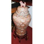 A large 20th century Chinese temple jar and cover, the lid with dog of fo and with floral enamel and