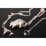 A white metal pendant, fashioned as a squirrel, on a multi-link neck chain; together with one