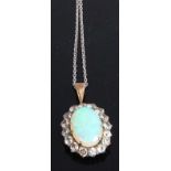 A yellow and white metal, opal and colourless sapphire oval cluster pendant, the opal cabochon