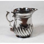 A silver cream jug, having wrythen decoration and C-scroll handle, 3.5oz