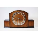 A 1950s oak cased mantel clock, having raised Arabic numerals and eight day movement, w.37cm