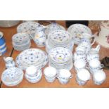 A Royal Copenhagen 12-place setting tea and dinner service, underglazed blue decorated with flowers,