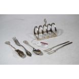 A George V silver four-division toast rack; together with a continental silver sugar scoop; and