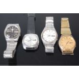 Four various gent's Seiko Five sports automatic wristwatches, each with day-date apertures