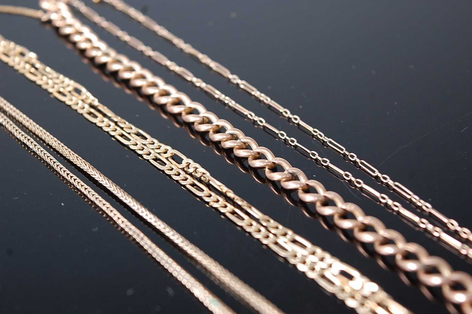 A 9ct gold hollowlink bracelet, 4.7g; together with three modern 9ct gold necklaces, gross weight