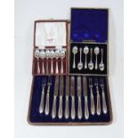 A cased set of six silver handled dessert knives and forks, in fitted leather case (one fork
