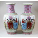 A pair of 20th century Chinese famille rose porcelain vases, of baluster form, decorated with