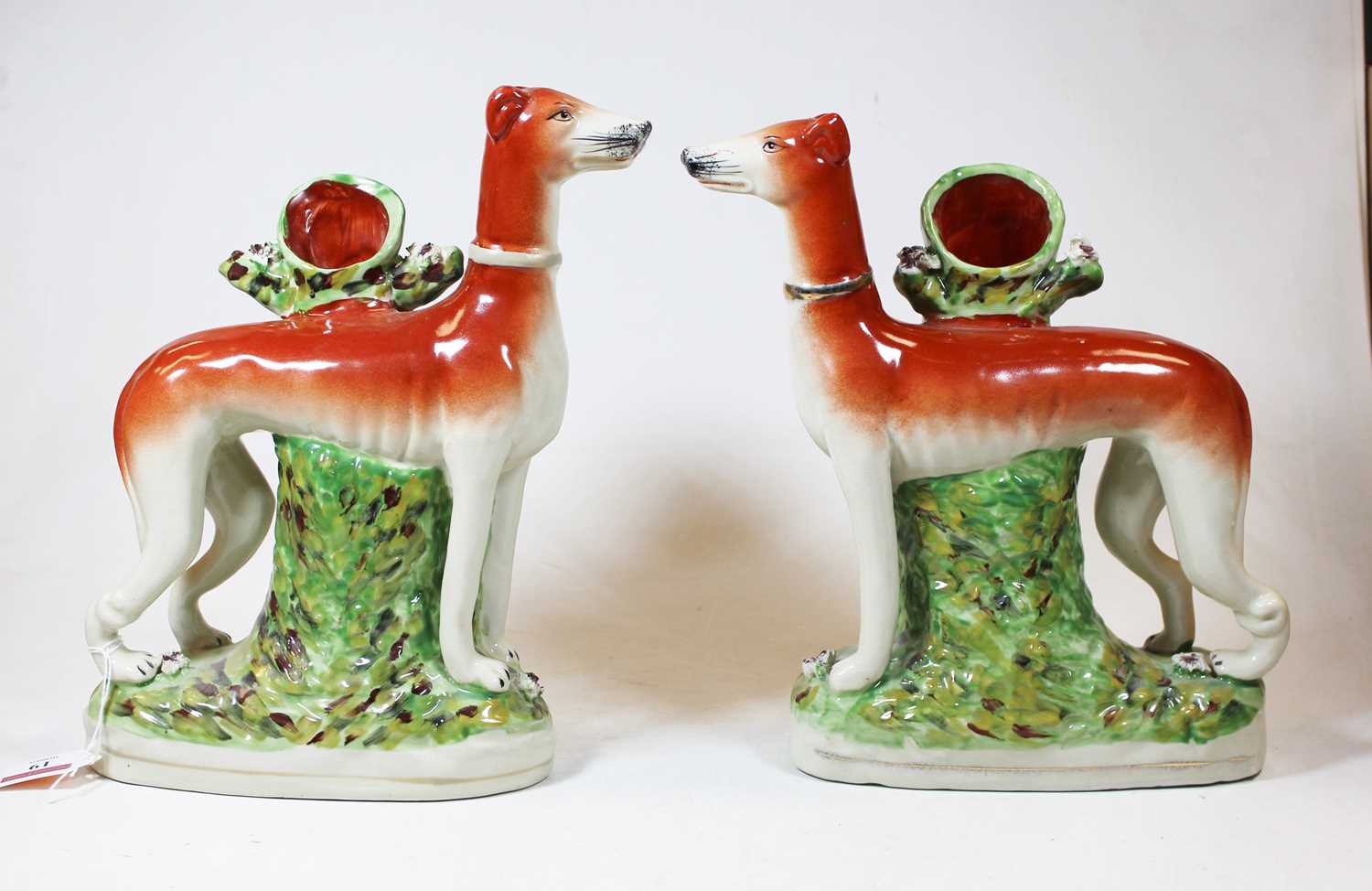 A pair of reproduction Staffordshire pottery models of greyhounds, 20th century, h.27cmCondition