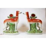 A pair of reproduction Staffordshire pottery models of greyhounds, 20th century, h.27cmCondition