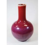 A Chinese export flambe glazed vase with cylindrical neck above a globular body, 34cm