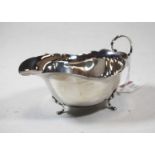 A George V silver sauceboat, of plain undecorated form, raised on hoof feet, 2.6oz