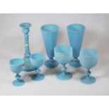 A small collection of pale blue milk glass, to include a pair of conical vases, a pair of goblets