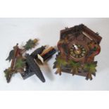 A 20th century Swiss carved pine cuckoo clock