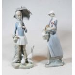 A Lladro Spanish porcelain figure of a lady holding a hen, having printed mark verso, h.24cm;