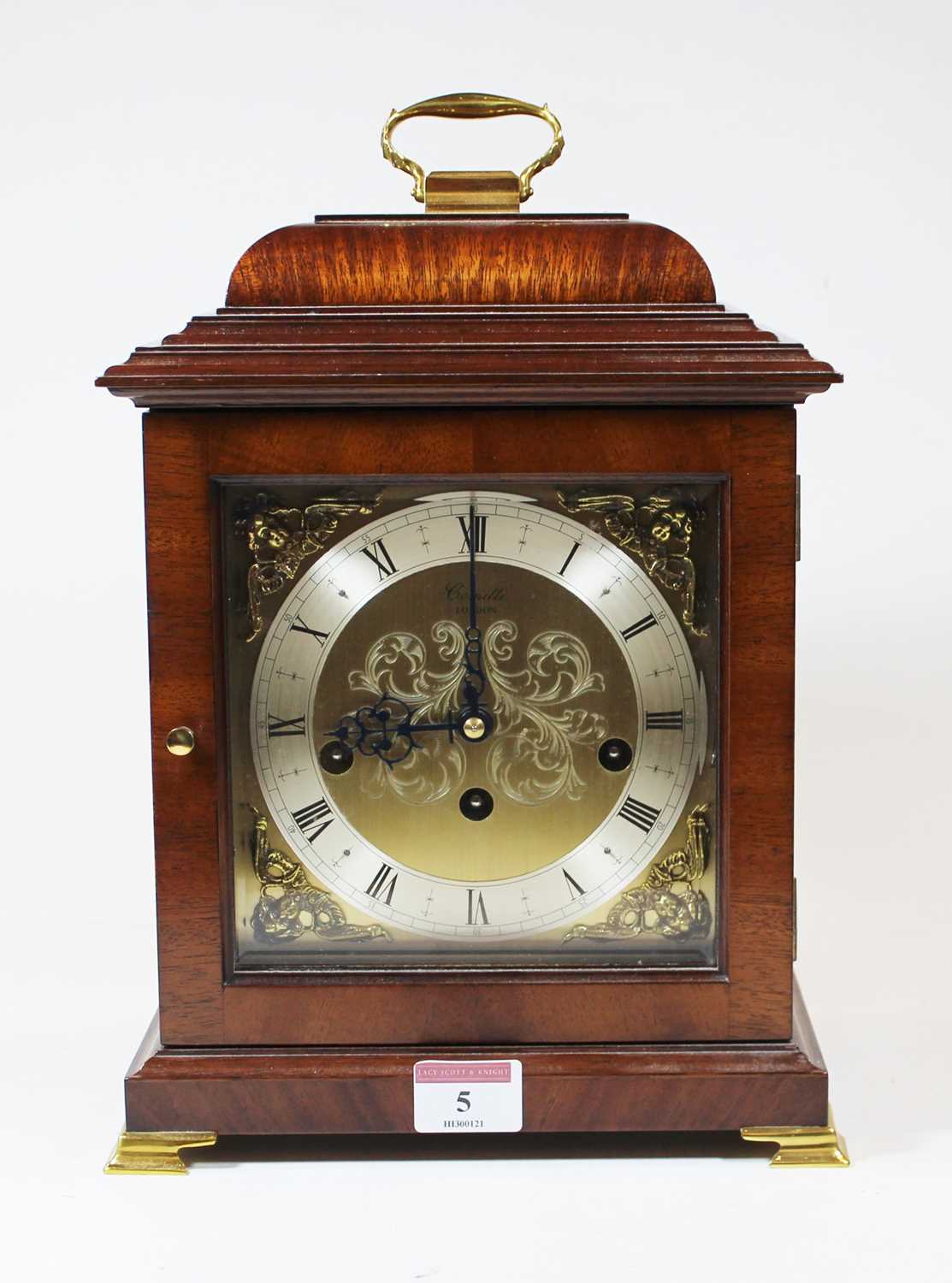 An 18th century style walnut bracket clock, the silvered chapter ring showing Roman numerals, the