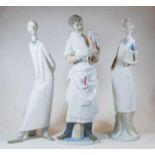 A large Lladro Spanish porcelain model of an obstetrician doctor with newborn baby, printed Lladro
