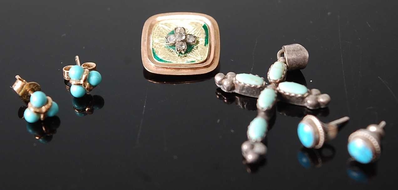 A white metal and turquoise set cross pendant; together with a pair of white metal and turquoise set