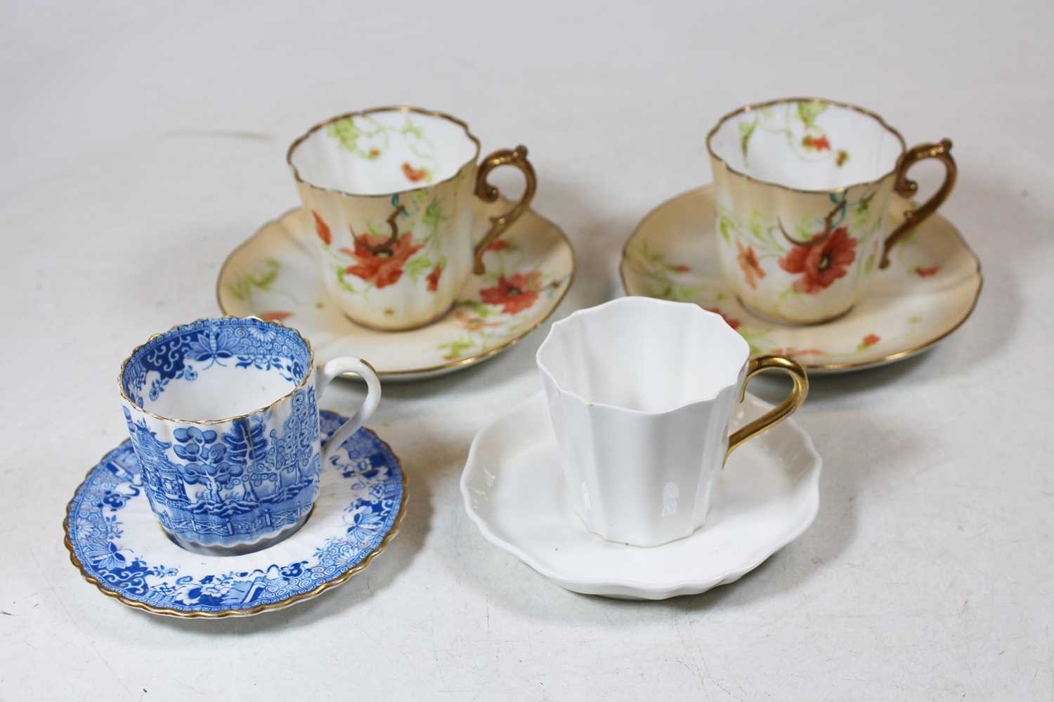 A Wedgwood porcelain part tea service; a Copeland's blue and white transfer decorated part tea