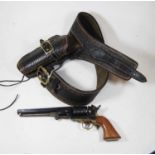 A reproduction model of a Colt revolver in stitched leather gun beltCondition report: The holster