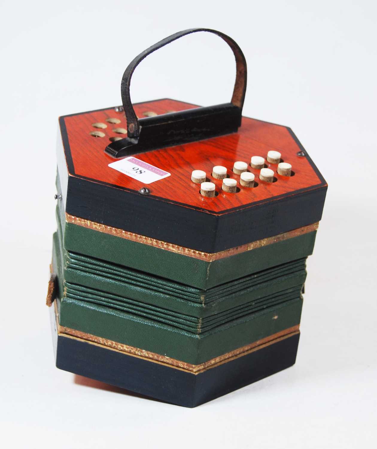 A 20th century squeezebox, of typical hexagonal form