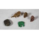 A small carved stone netsuke in the form of a beetle; together with four small carved stone animals,