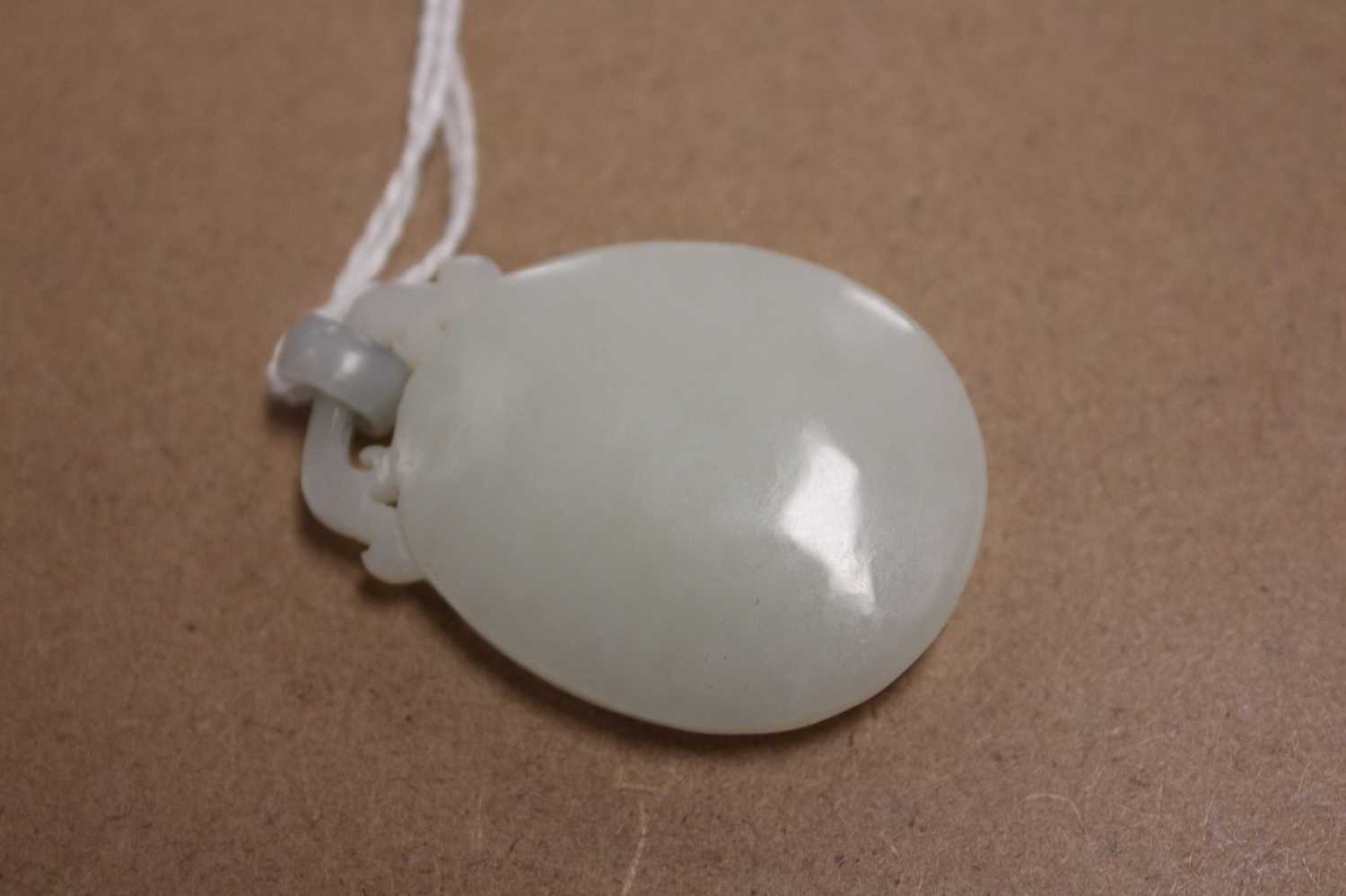 A Chinese pale celadon jade pendant, 41mm (excluding bale), 17.4g - Bild 9 aus 16