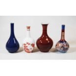 A collection of four Chinese export bottle vases, to include a Sang du boeuf example, largest height