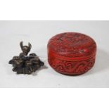 A Chinese/Tibetan bronze spice container, the screw top in the form of a skull above six