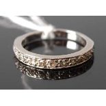 A white metal diamond 14-stone half hoop eternity ring, featuring Old European and rose cut diamonds