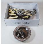 A box of miscellaneous silver plate, to include Old Sheffield Plate bottle coaster, loose flatware