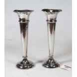 A pair of sterling silver trumpet shaped spill vases, each on loaded base, h.19cm