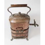 A 19th century copper kettle, with copper tap and on a pierced rectangular stand with spirit