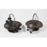 A pair of circa 1900 Chinese silver baskets, of woven form, the entwined handle decorated with