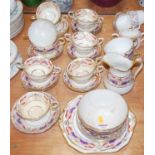 A 19th century part dinner service, on a cream ground with fern leaf decoration in shades of iron