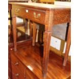 An early 20th century oak and rexine inset single drawer writing table, width 76cm