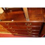 An early 19th century mahogany square front chest of two short over three long graduated drawers