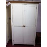 A contemporary white painted double door wardrobe, having light oak cavetto cornice, width 118.5cm