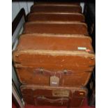 A brown canvas and wooden bound trunk; and one other similar (2)