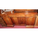 An early Victorian mahogany and flame mahogany serpentine front inverted breakfront four door