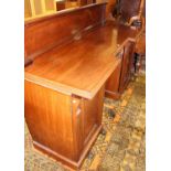 An early Victorian mahogany ledgeback inverted breakfront pedestal sideboard having single central