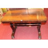 A mid-Victorian rosewood round cornered side table, raised on squat turned supports, width 99.5cm