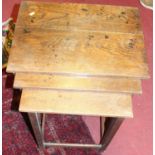An oak nest of three occasional tables, the largest width 55.5cm