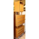 A pair of 1970s Stag light oak three drawer chests, each raised on turned tapering supports, width