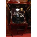 A 1930s mahogany gramophone cabinet by Selectaphone, the hinged cover housing a fitted gramophone