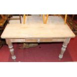A Victorian pine round cornered single drawer kitchen table raised on turned supports, length